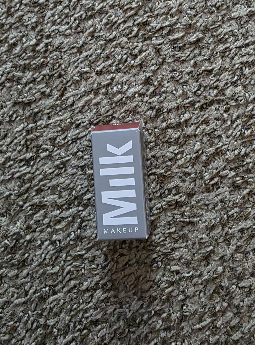 Milk Makeup Lipstick in Gray Box with Red Accent